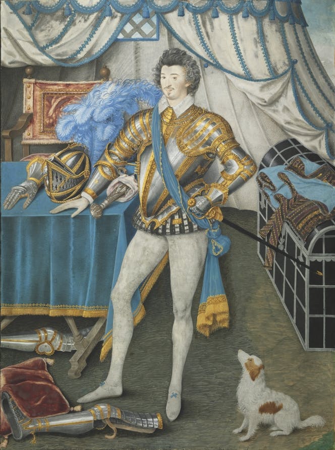 A man in white tights and an ornate silver and gold armor top. A small white and brown dog stares up at him, and his hand rests on a table with additional pieces of armor, including a helmet. Other pieces are strewn on the floor.